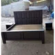 chocolate brown wooden bed with two side drawers