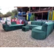 green L-shaped sofa with a sofa bed